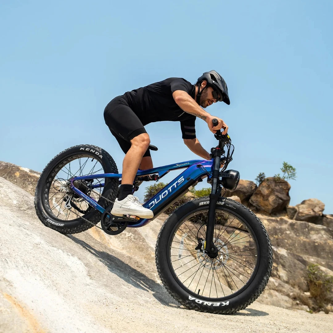 Electric Bike Duotts E26, robust design, wide tires, suitable for off-road adventures, rider in action.