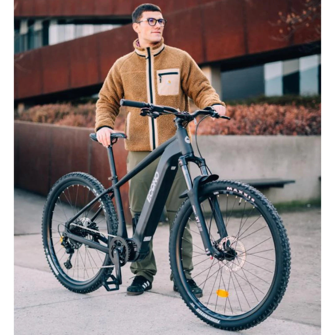 Electric Bike Econo Gams Suv C6, stylish e-bike with a sleek black frame, rugged tires, and urban backdrop.