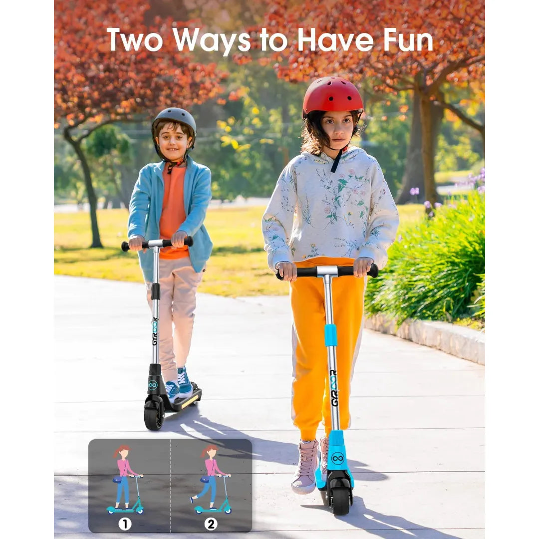 Izdelek na sliki je električni skiro, model Gyroor H30. Na sliki sta vidna dva otroka, ki se vozita na skirojih v parku. Oba nosita čelade za zaščito, okolica pa je obdana z drevesi in zelenjem, kar ustvarja prijetno vzdušje za igro in zabavo.