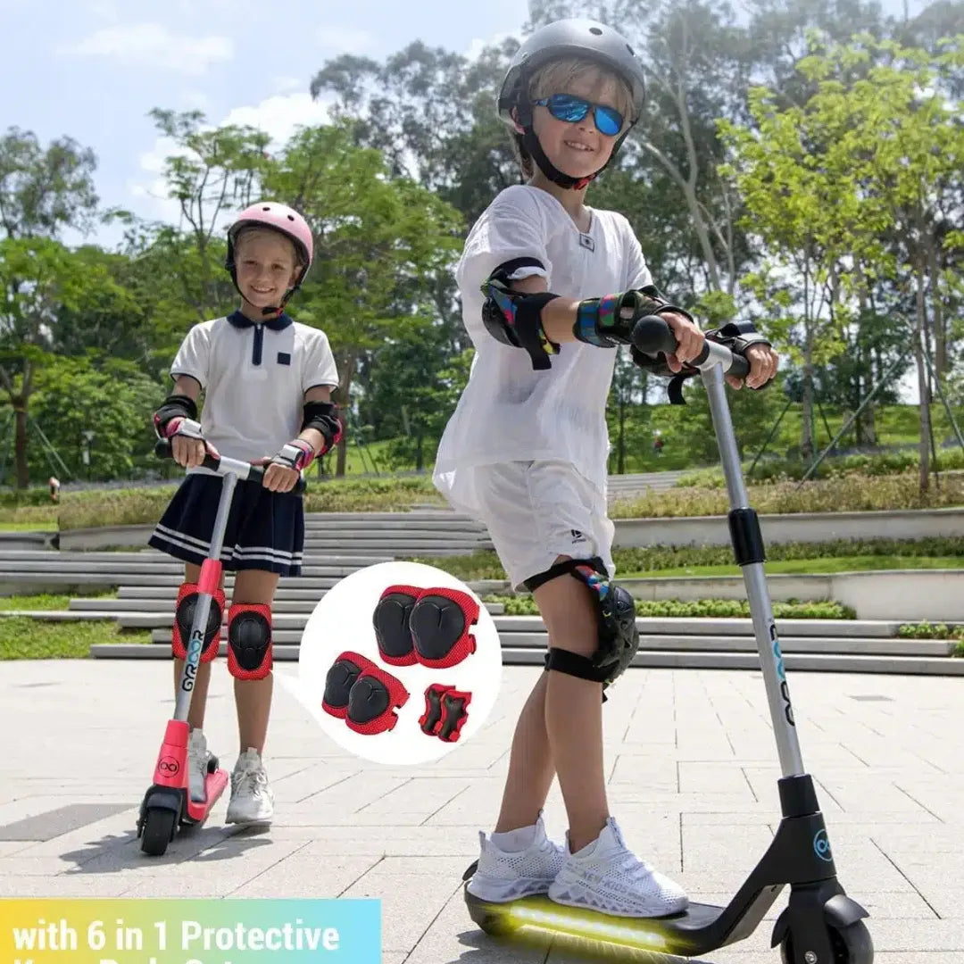 Izdelek na sliki je električni skiro znamke Gyroor, model H30. Na sliki sta prikazana dva otroka, ki se vozita na skirojih v parku. Oba nosita zaščitno opremo, vključno s čeladami in zaščitnimi blazinicami za kolena ter komolce. V ospredju je prikazana tudi zaščitna oprema, ki vključuje različne blazinice.