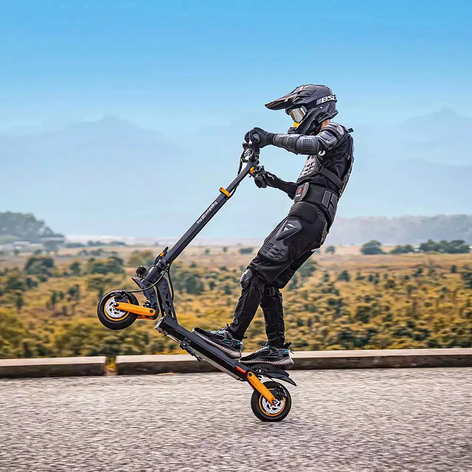 Electric Scooter Kukirin G2 Pro features a sleek design, showcasing a rider performing a stunt outdoors.