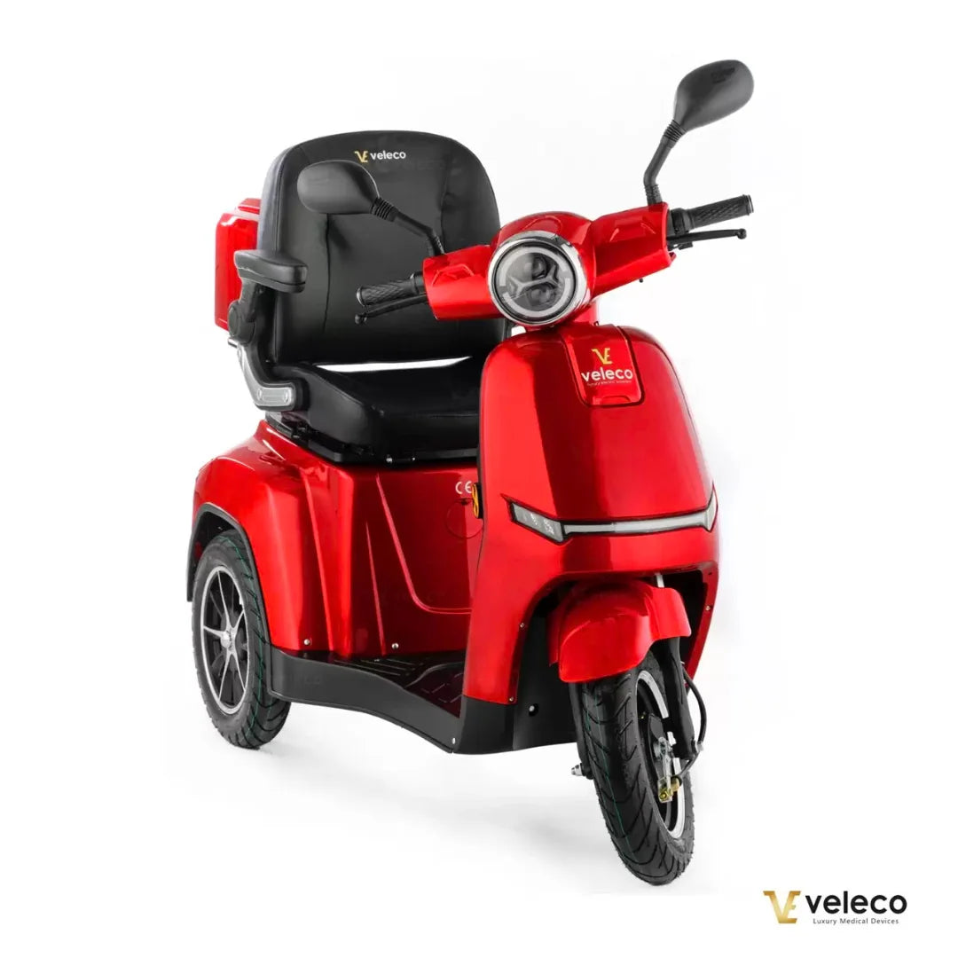 Electric Mobility Scooter Veleco Turris, a vibrant red three-wheeled scooter with comfortable seating.
