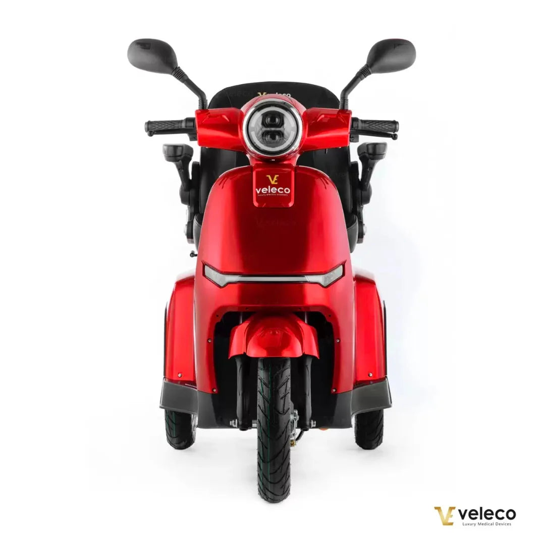 Electric Mobility Scooter Veleco Turris, stylish red design, comfortable seating, ideal for mobility assistance.