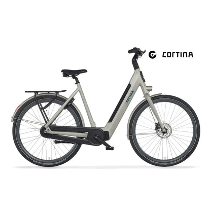 Elegantno električno kolo Cortina E Nite v svetlo sivi barvi z minimalistično obliko in robustnimi pnevmatikami.