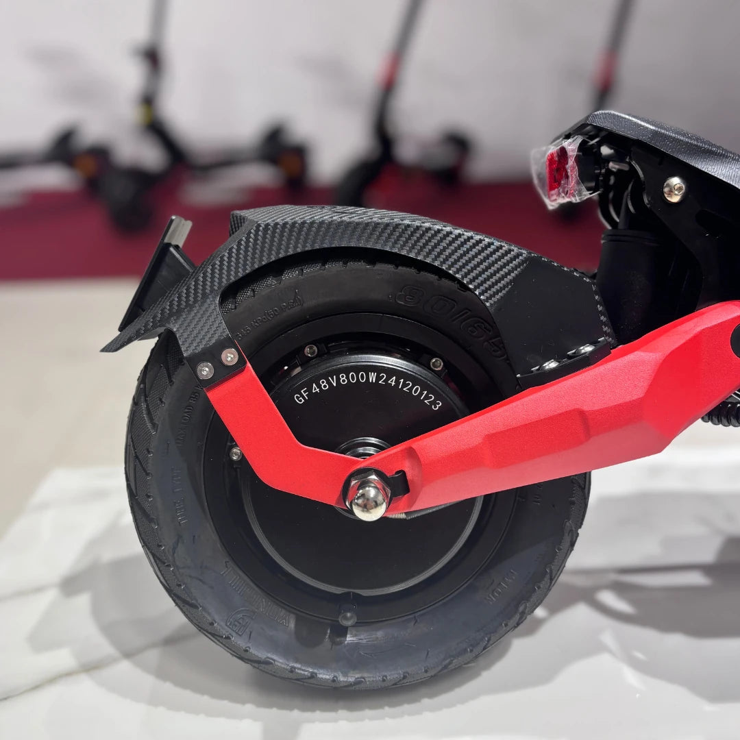 Electric Scooter Eco Speed 9 features a durable tire, sleek carbon fiber fender, and vibrant red arm.