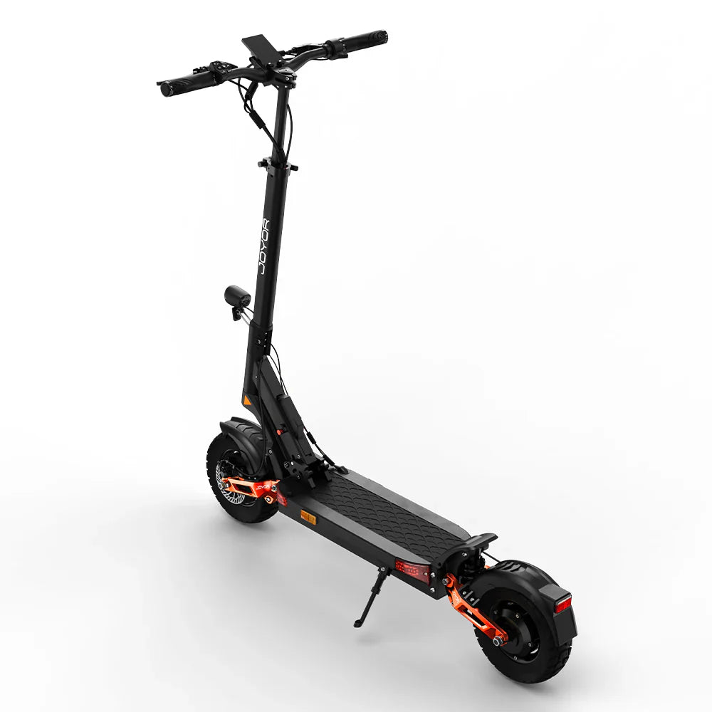 The product is the Joyor T10 electric scooter. The scooter is pictured in black with orange details. It features a wide standing platform, ergonomic handlebars, and robust tires, which suggests good stability and a comfortable ride.
