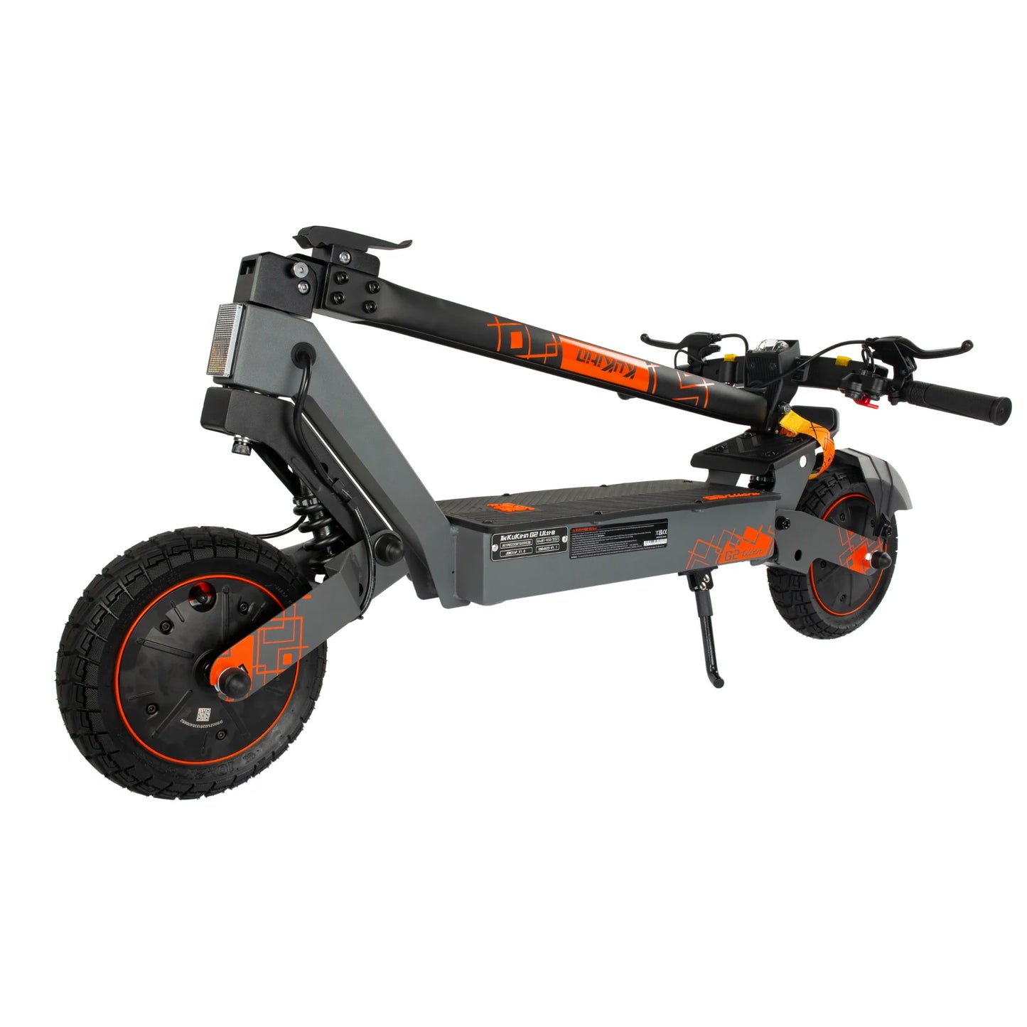 The product in the picture is an electric scooter, the Kukirin G2 Ultra model. The picture shows the scooter in its folded form, with a black and orange color scheme. It features wide tires, a robust construction, and handlebars with grips. The specifications are marked on the scooter's deck, indicating its performance and features.