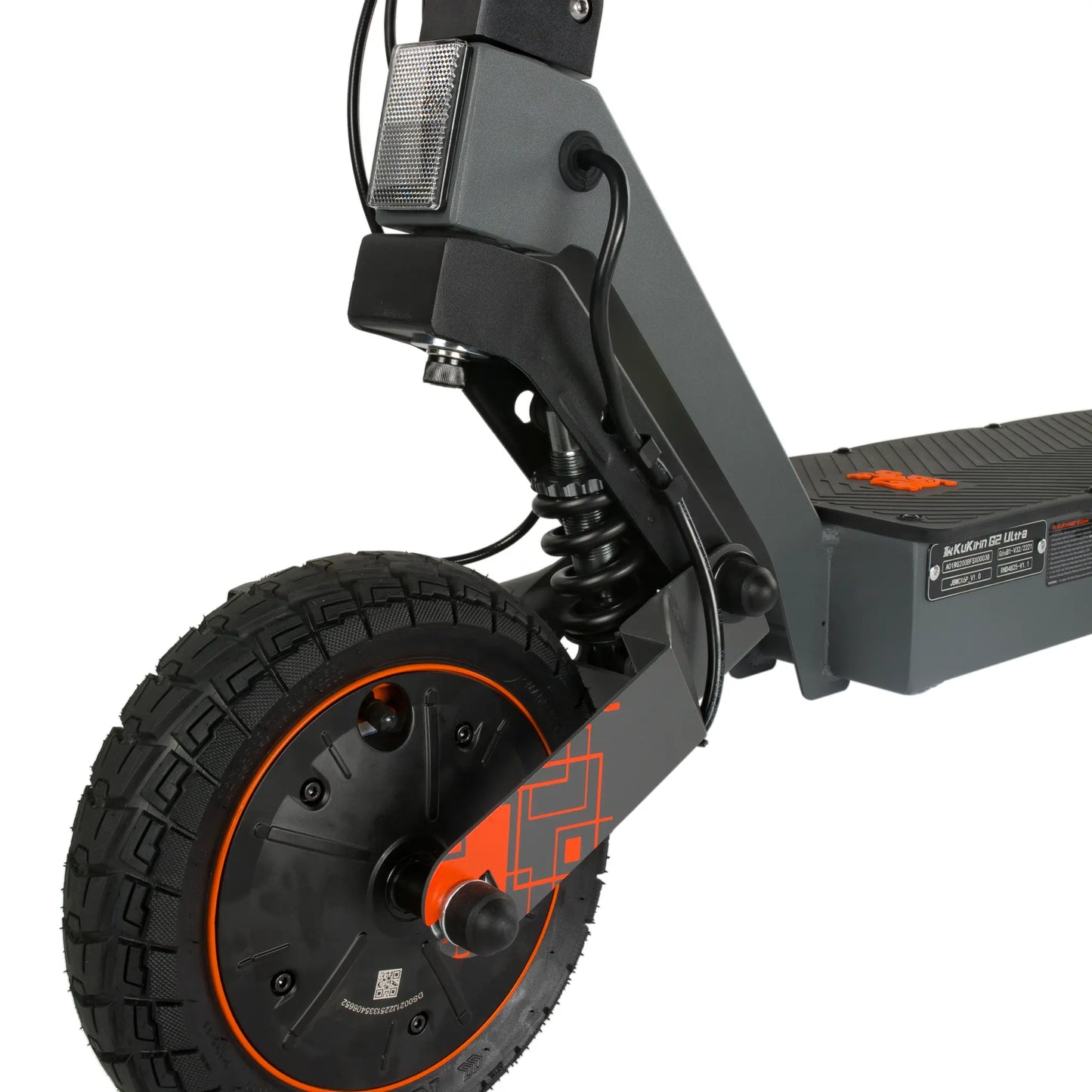 The product in the picture is a Kukirin G2 Ultra electric scooter. The image shows a part of the scooter, including the front wheel, the suspension, and the area where the cables are located. The wheel has a robust profile with a textured pattern, which ensures better grip. The color combination includes gray and orange, giving the scooter a modern look.