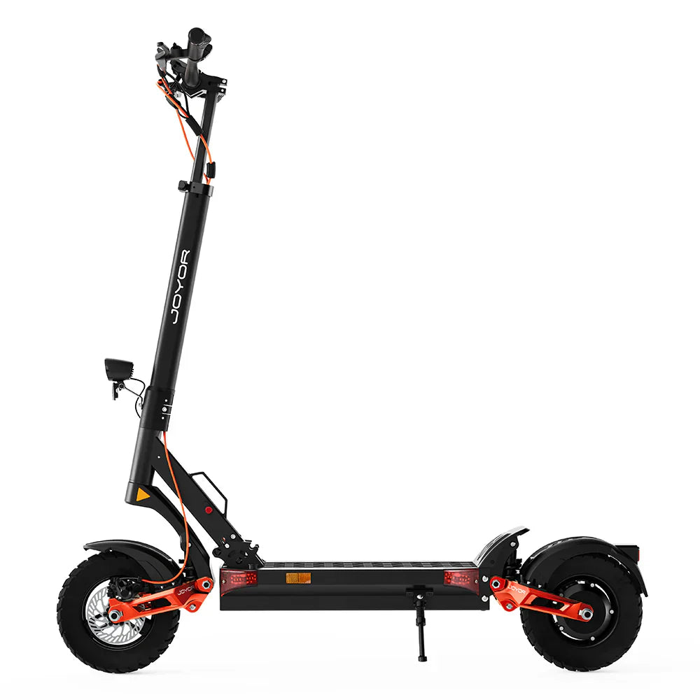 The product in the picture is a Joyor T6 electric scooter. The picture shows a side view of the scooter, which has a black and orange color combination. It is equipped with wide tires, a robust frame, and a standing deck. The handlebars with controls are also visible.