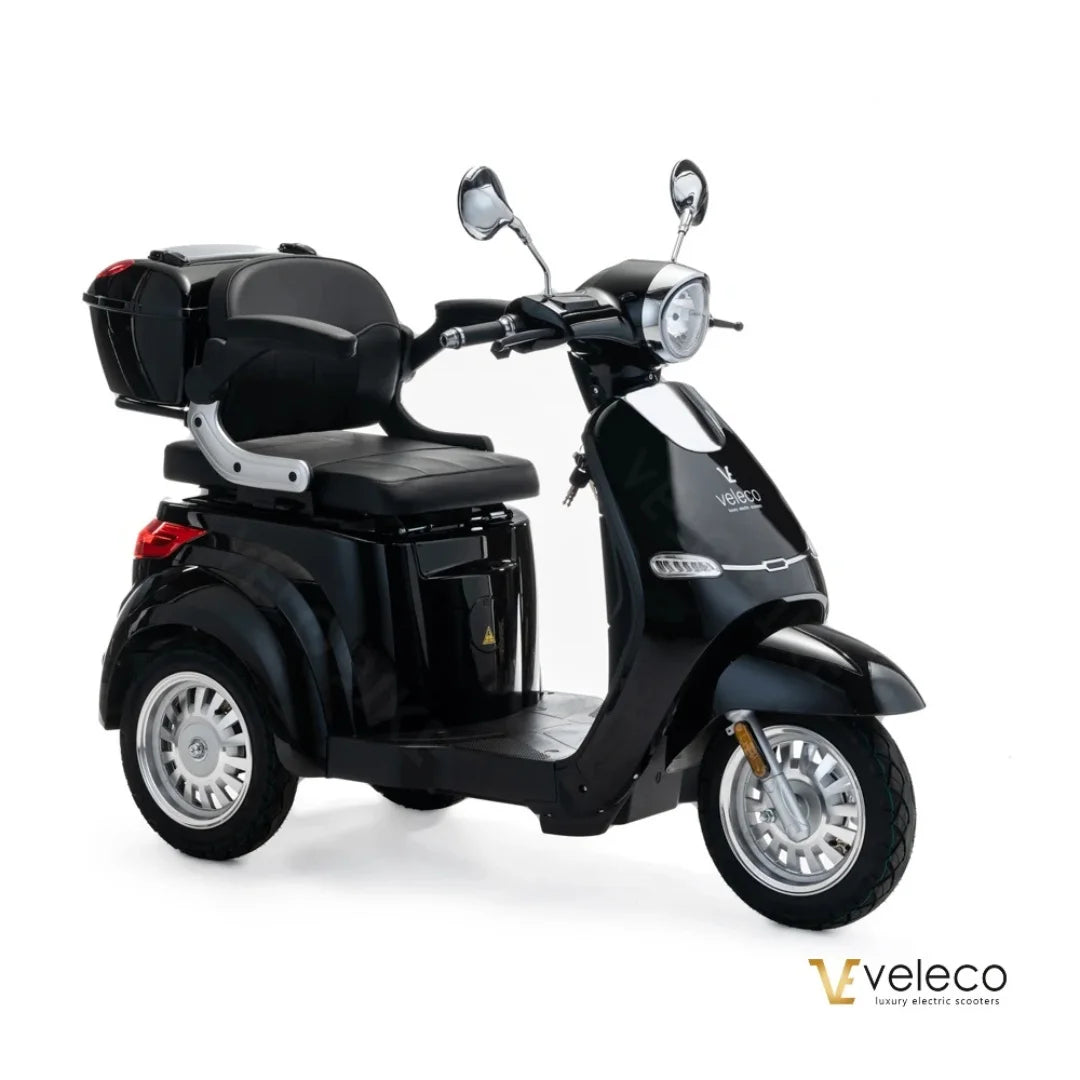 Električni mobilni voziček Veleco Cristal v elegantni črni barvi z udobnim sedežem in škatlo za shranjevanje.