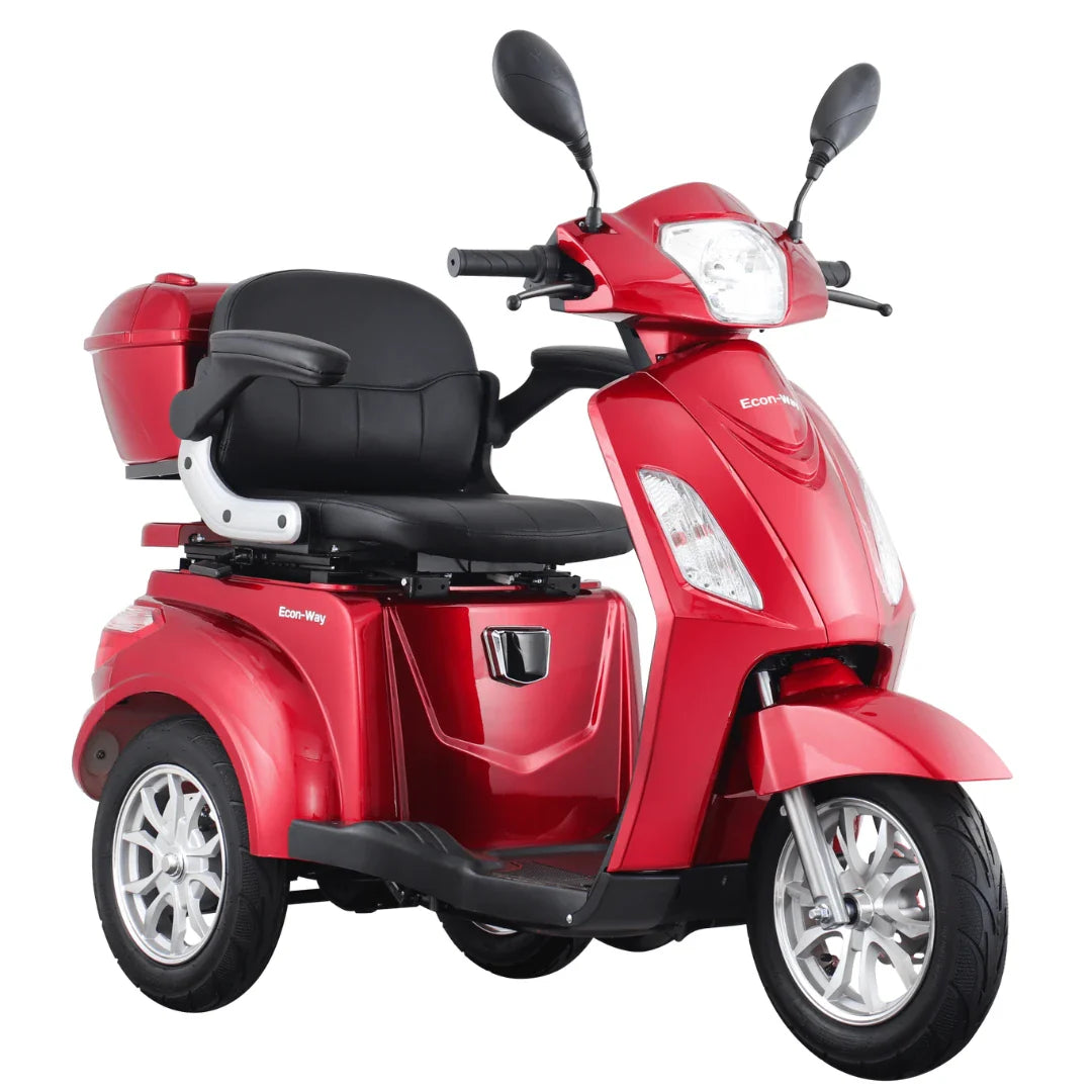 Izdelek na sliki je električni skuter s tremi kolesi, model Vigorous Vista 1, znamke Econ-Way. Skuter je v rdeči barvi in ima udobno sedežno mesto s naslonjali za roke. Na sprednjem delu so vidne luči in ogledala, kar nakazuje na njegovo uporabo v urbanem okolju. Zadnji del skuterja vključuje tudi prostor za shranjevanje.