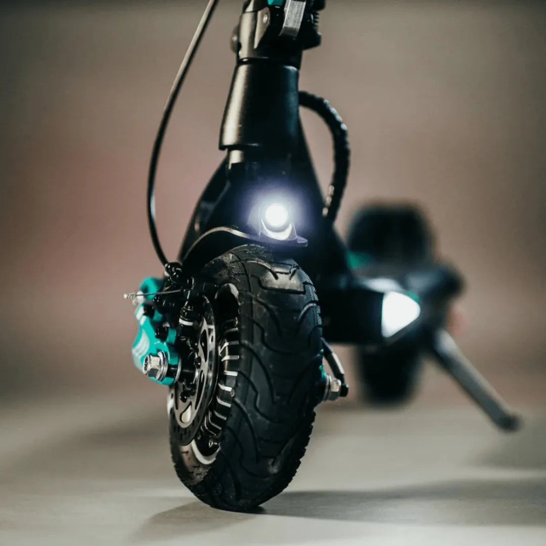 Electric Scooter Vsett 9 features a robust tire, bright headlight, and sleek design for a smooth ride.