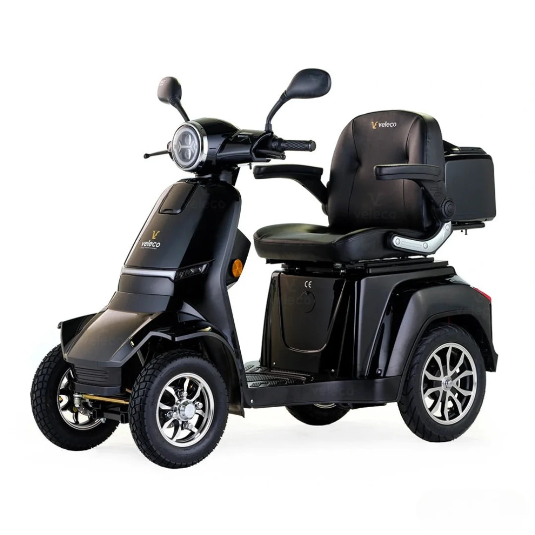 Črn električni mobilni voziček Veleco Gravis z udobnim sedežem in prostorom za shranjevanje.