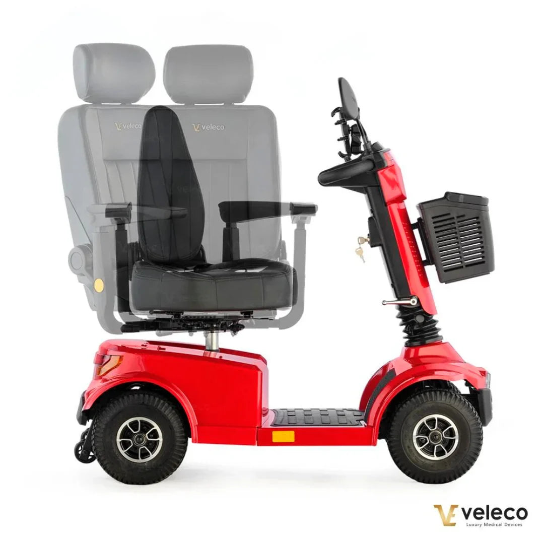 Izdelek je električni skuter, znamke Veleco, model Jumpy. Na sliki je prikazan rdeč električni skuter s širokim sedežem in naslonjali za roke. Skuter ima tudi prostor za shranjevanje ter ergonomski dizajn, kar omogoča udobno vožnjo.
