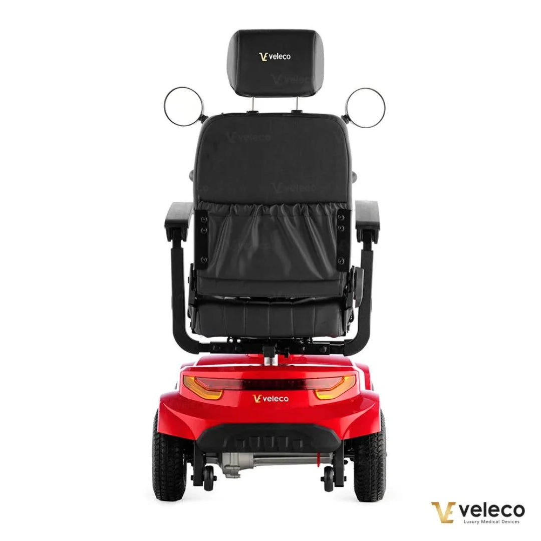 Rdeči električni mobilni voziček Veleco Jumpy, pogled od zadaj, ki prikazuje njegovo elegantno obliko.