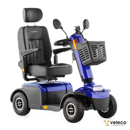 Modri električni mobilni voziček Veleco Looper z udobnim sedežem in sprednjo košaro.